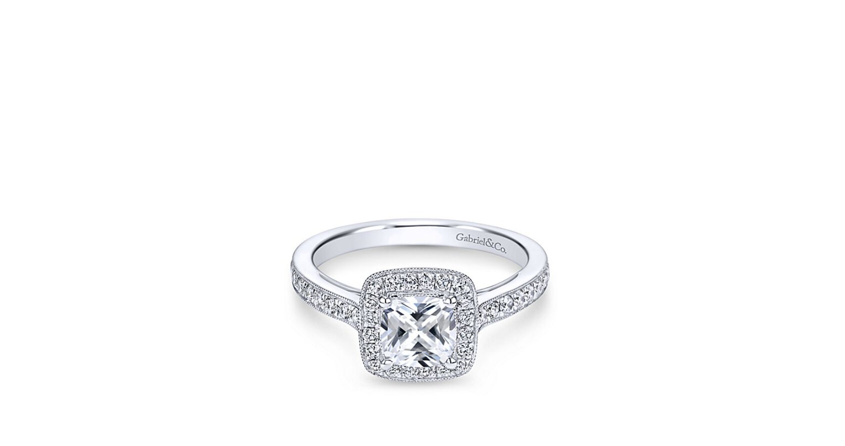 For a timeless look, this white gold engagement ring boasts round diamond adornments on the band and halo accented with milgrain edges