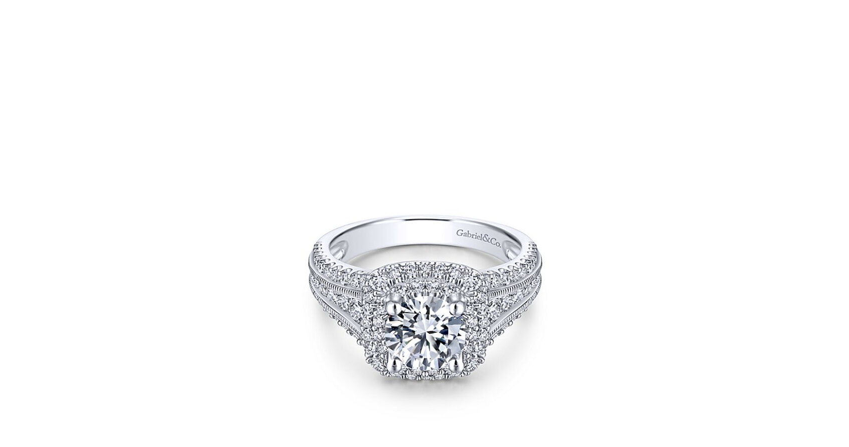 The double halo engagement ring glimmers all around with its vast diamond setting. Truly exceptional detailing within each pave and channel.