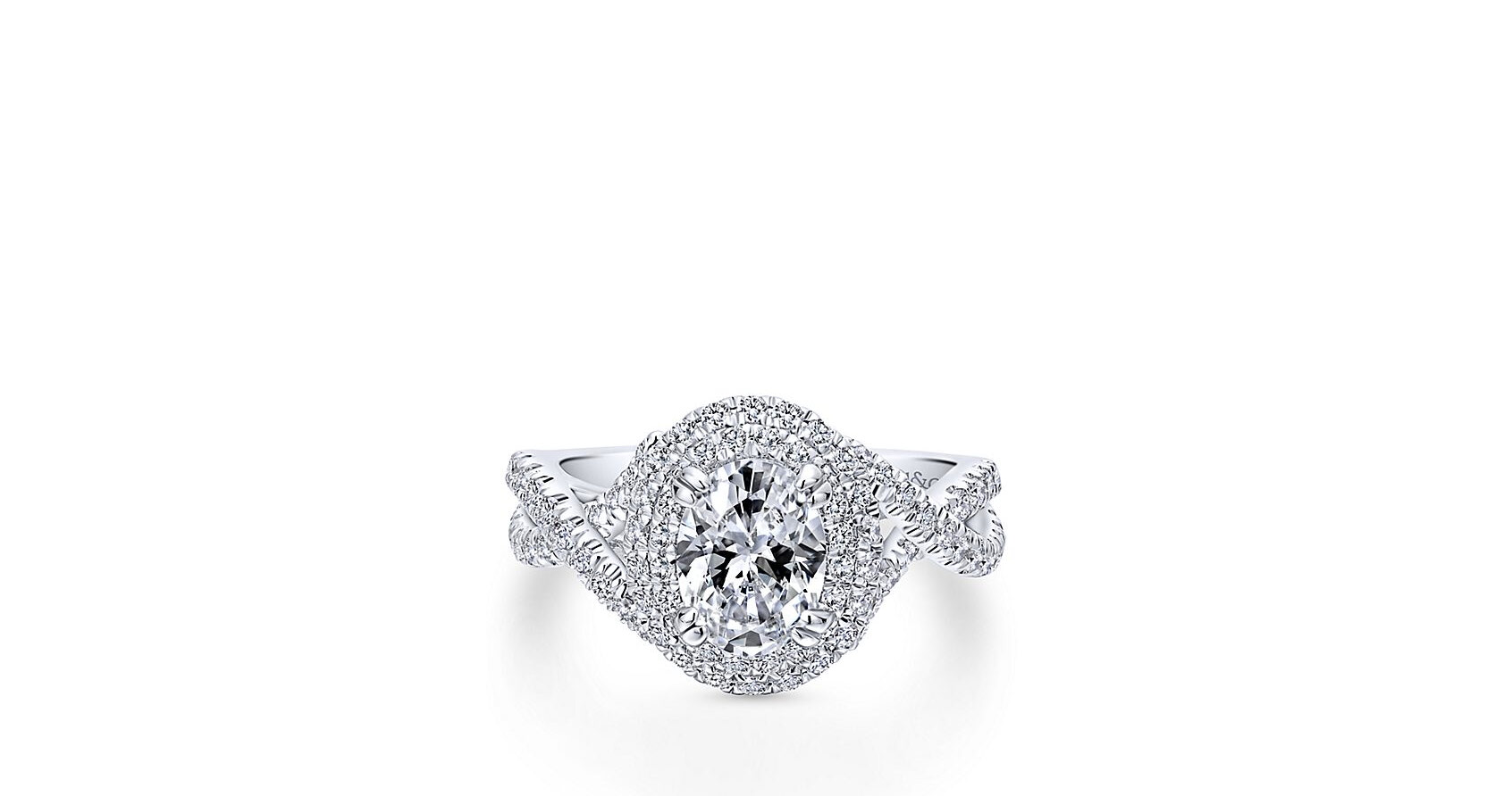 Achieve maximum sparkle with this modern engagement ring featuring two pave diamond halos looped around the oval cut center stone, plus a band of criss crossing diamond ribbons