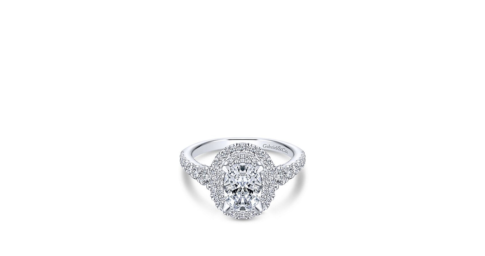 Two radiant diamond halos surround a oval cut center stone with a scalloped diamond band